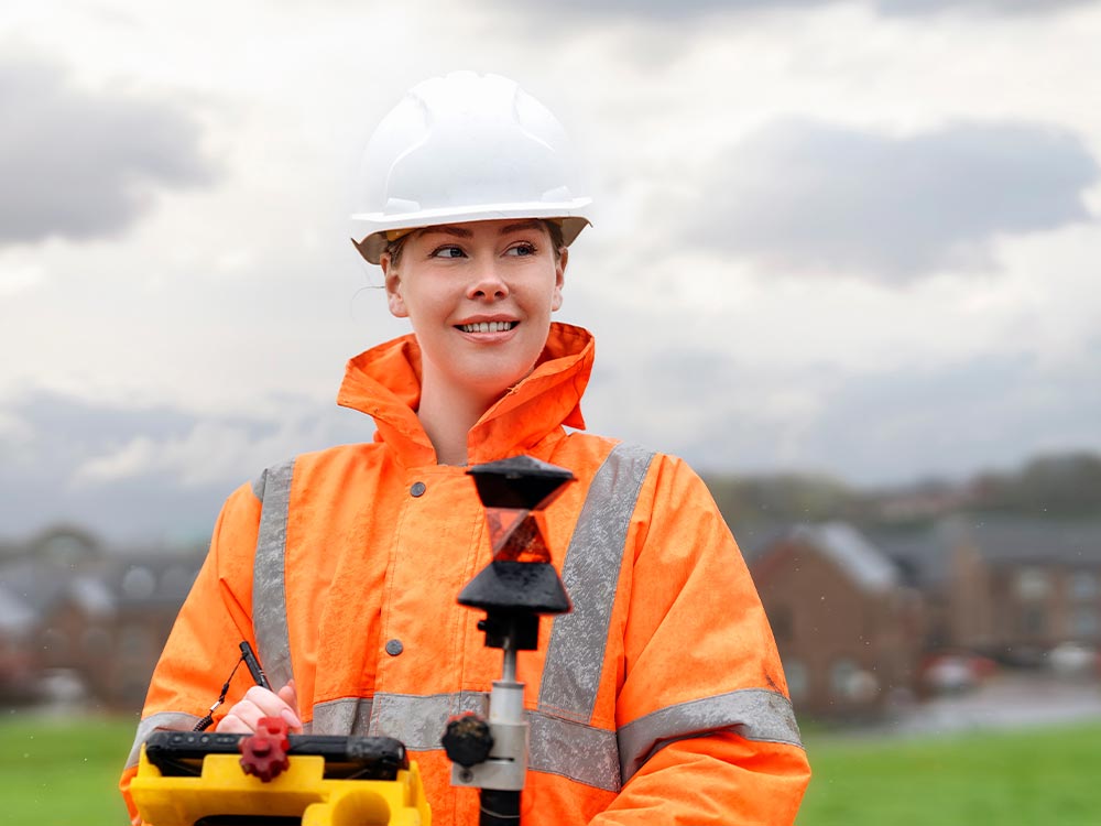 Land surveyor conducting site analysis for residential property development and asset management
