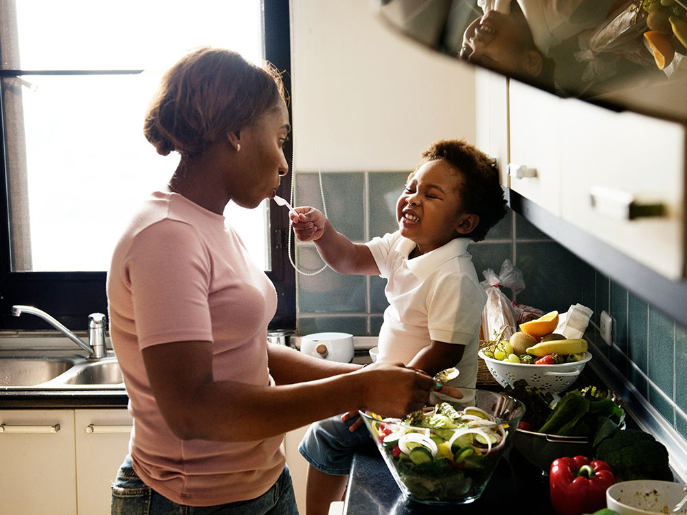 Mother and toddler enjoying a newly renovated kitchen unit provided through public sector kitchen procurement services
