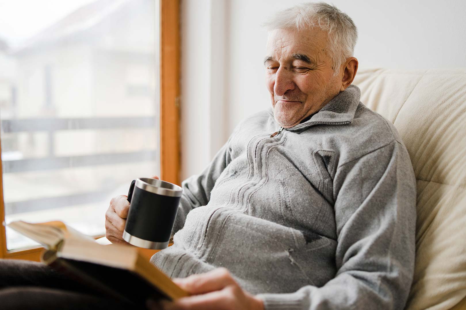 Senior supported living resident relaxing in comfortable social housing provided through a public sector procurement framework